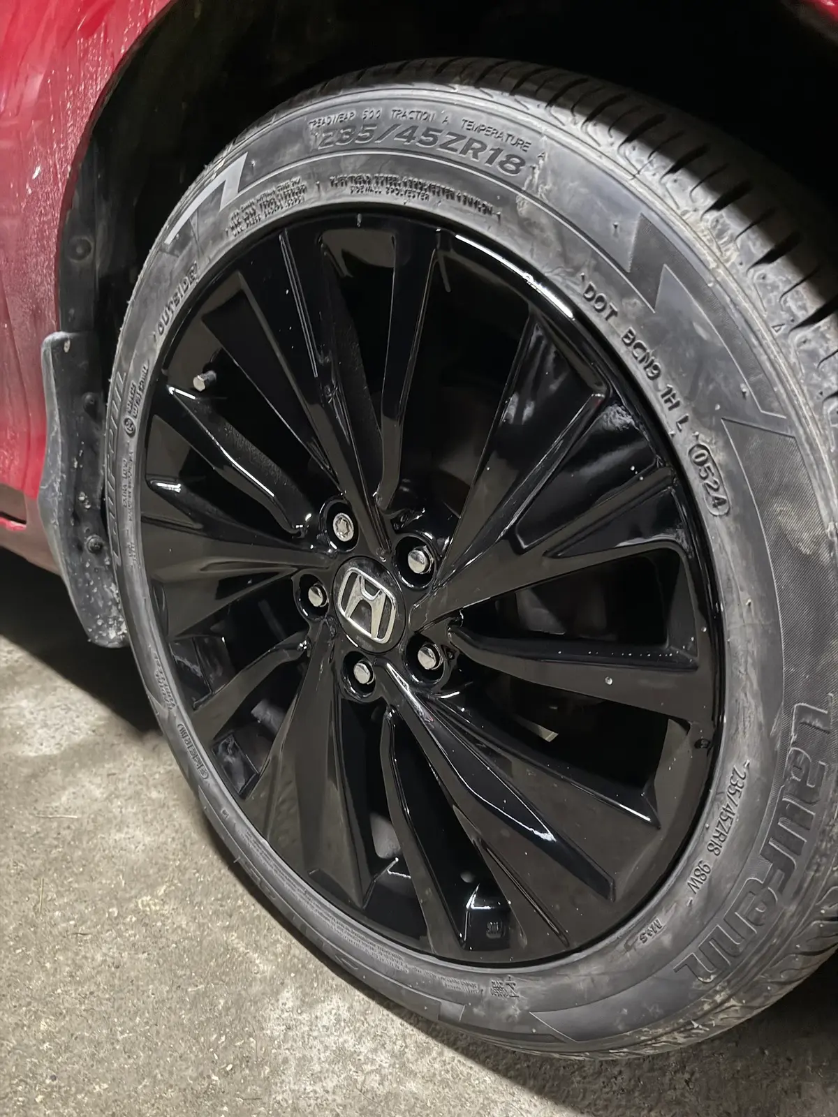 Gloss black alloy wheel refinished after