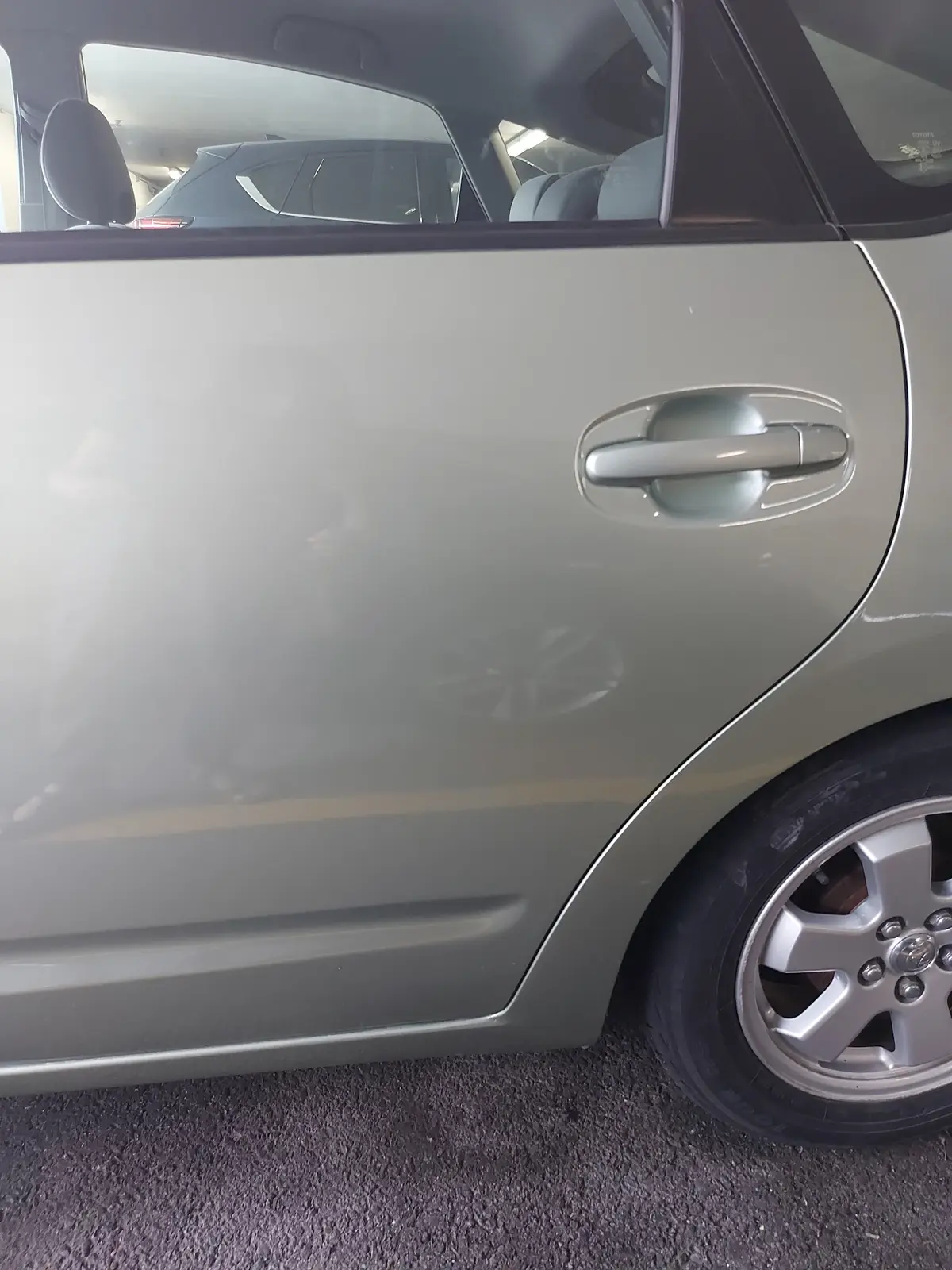 Same Toyota rear door smoothed and repaired after AutoStyle Collision