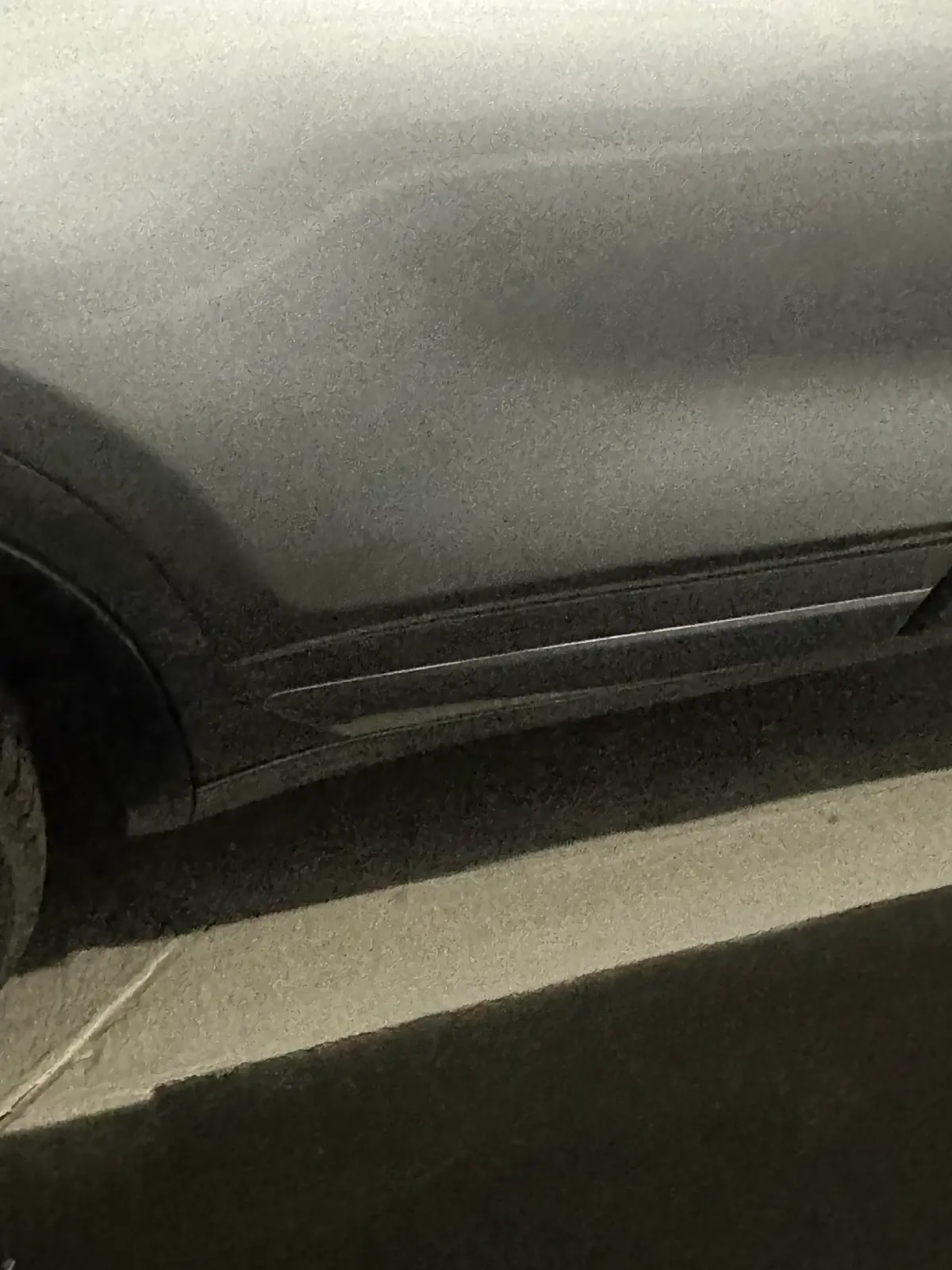 Silver SUV rocker panel after repair