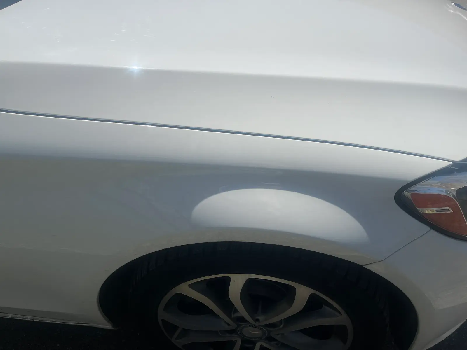 White car rear quarter panel repaired and repainted after AutoStyle Collision